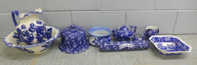 A Burleigh Calico blue and white rolling pin, a cheese dome and stand, tea pot, wash jug and bowl,