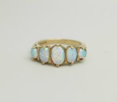 A 9ct gold, five stone opal ring, 4g, O