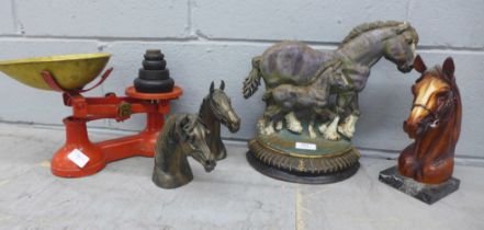 A horse door stop, two resin horse heads, a resin horse head on marble base and a set of