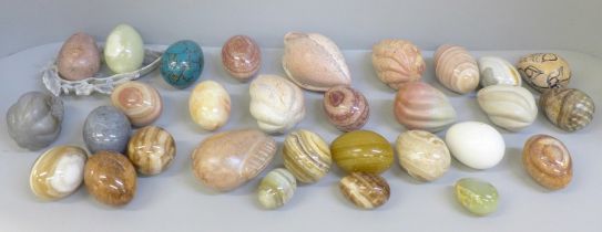 A collection of gemstone eggs, marble, agate, onyx and a Chinese carved soapstone dish, etc.