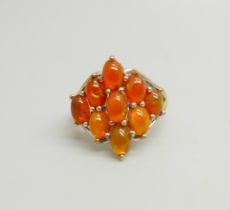 A silver gilt cabochon fire opal cluster ring, N