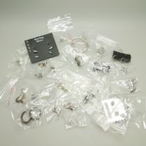 Twenty-five pairs of silver and white metal earrings