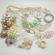 A collection of costume jewellery including brooches, bracelets, earrings and necklaces