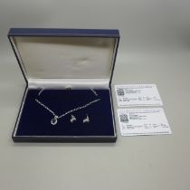 A silver, blue sapphire and white topaz pendant and matching earrings, with certificates