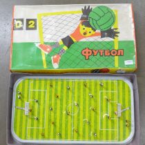 A vintage Soviet football metal stadium board game, spring players, 56 x 30 x 7.5cm