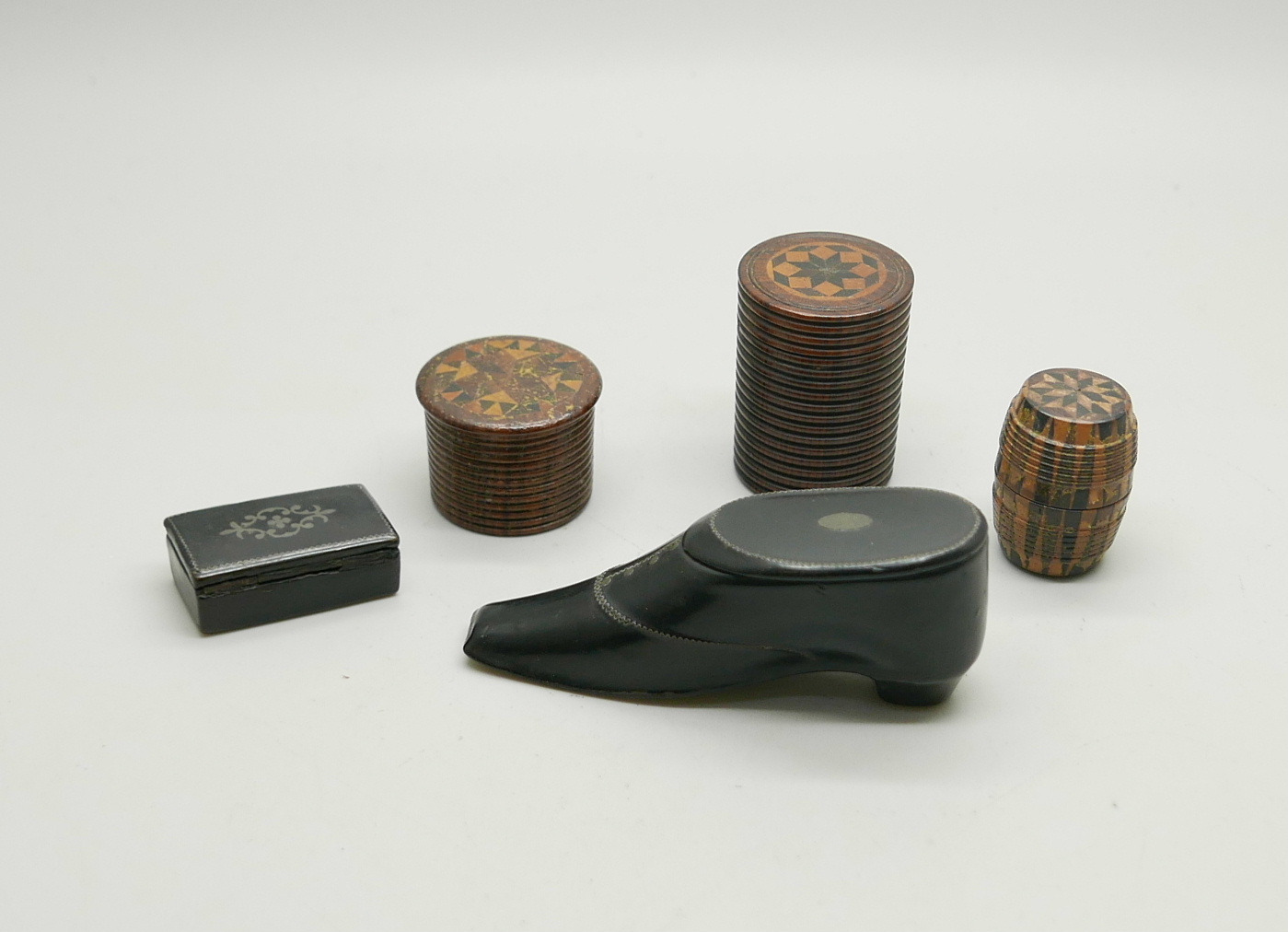 A collection of treen; three marquetry boxes and two snuff boxes including one in the form of a shoe