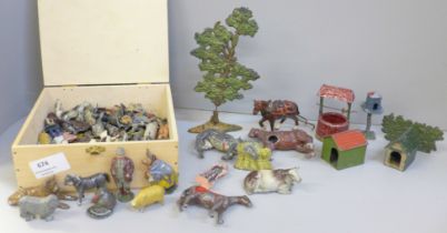 A collection of lead farmyard animals and accessories, playworn, some a/f