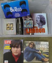 A box of The Beatles and solo books and DVDs, clock, etc.