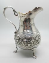 A Victorian silver jug, Exeter 1879, Josiah Williams & Co., with embossed decoration, 119g