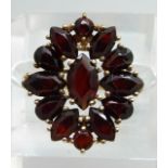 A 9ct gold and garnet cluster ring, 4.4g, N