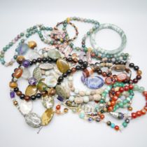 A collection of gemstone and hardstone necklaces and bracelets