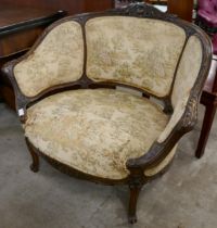 A 19th century French carved beech fabric upholstered fauteuil chair