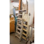 Four wooden ladders