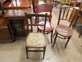 An oak barleytwist occasional table and three assorted chairs