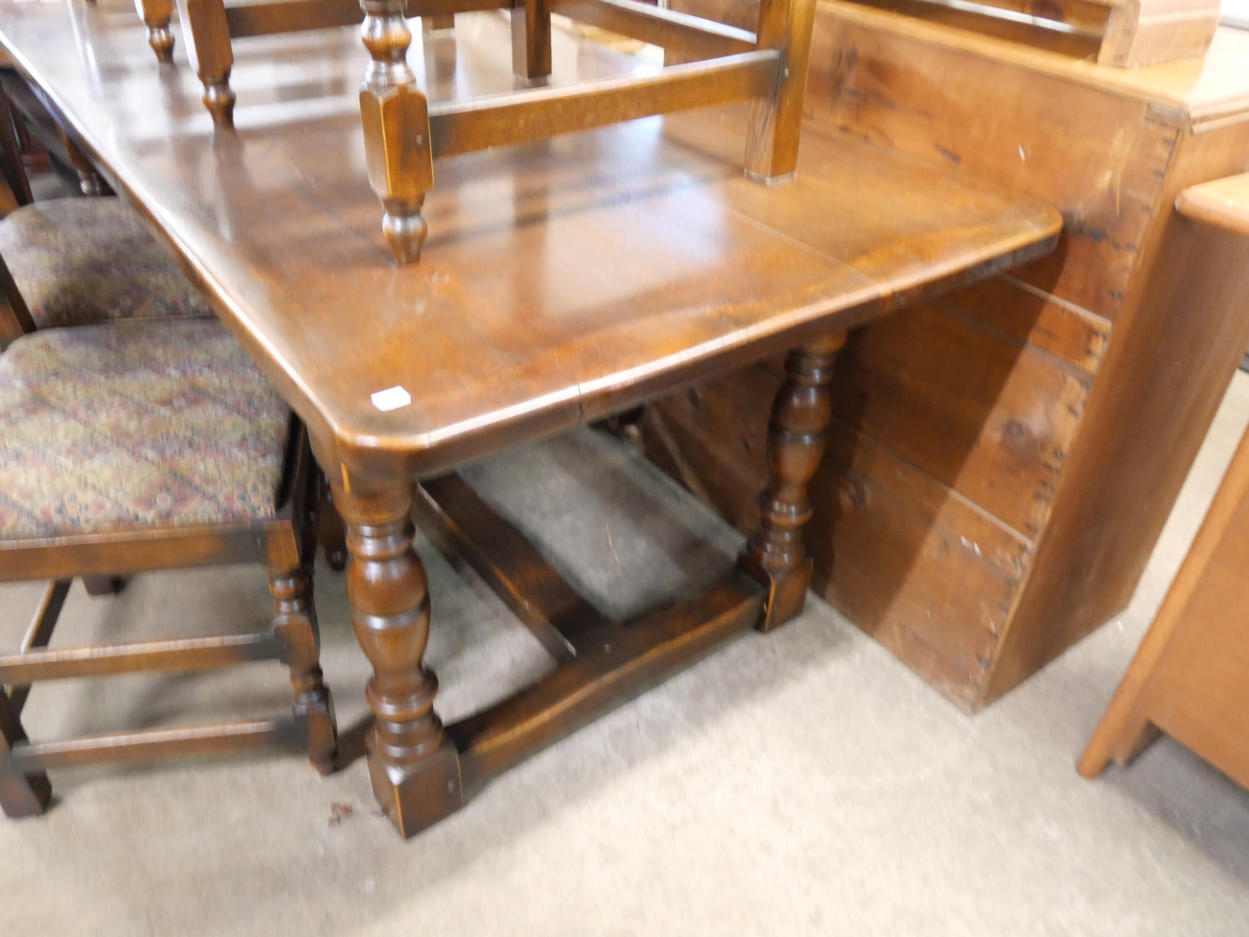 A 17th Century style carved oak refectory table and six chairs - Image 7 of 7