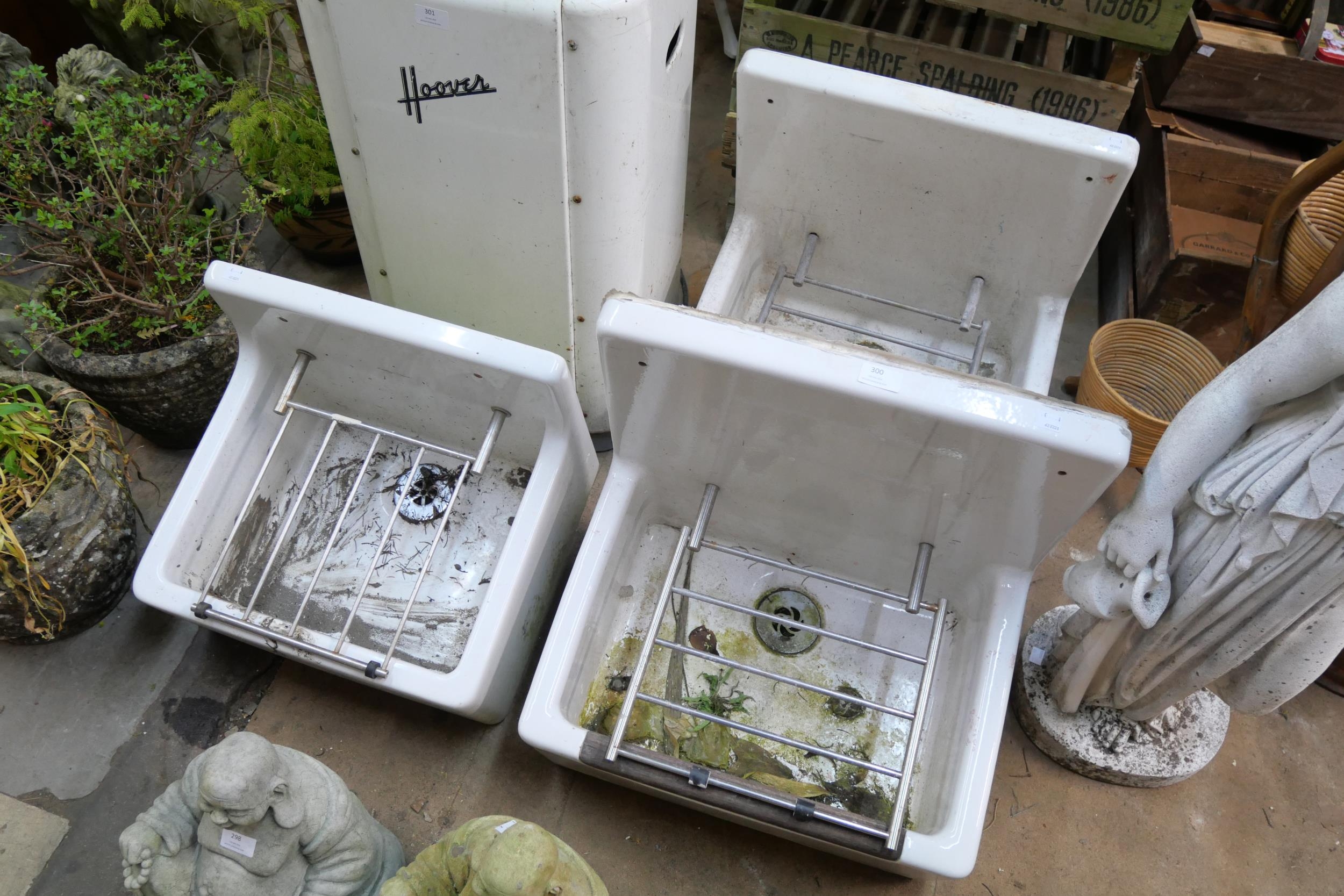 Three porcelain sinks