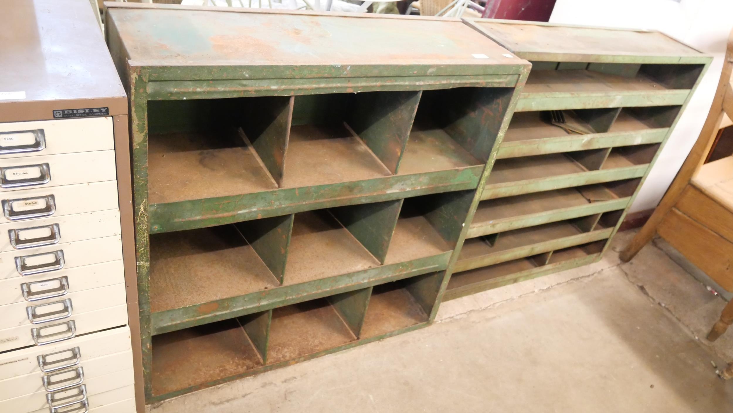 Two industrial green metal cabinets