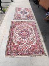 A Persian terracotta ground rug