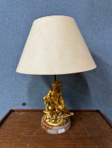 A French style gilt cherub table lamp, on marble plinth