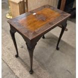 A late Victorian carved walnut side table