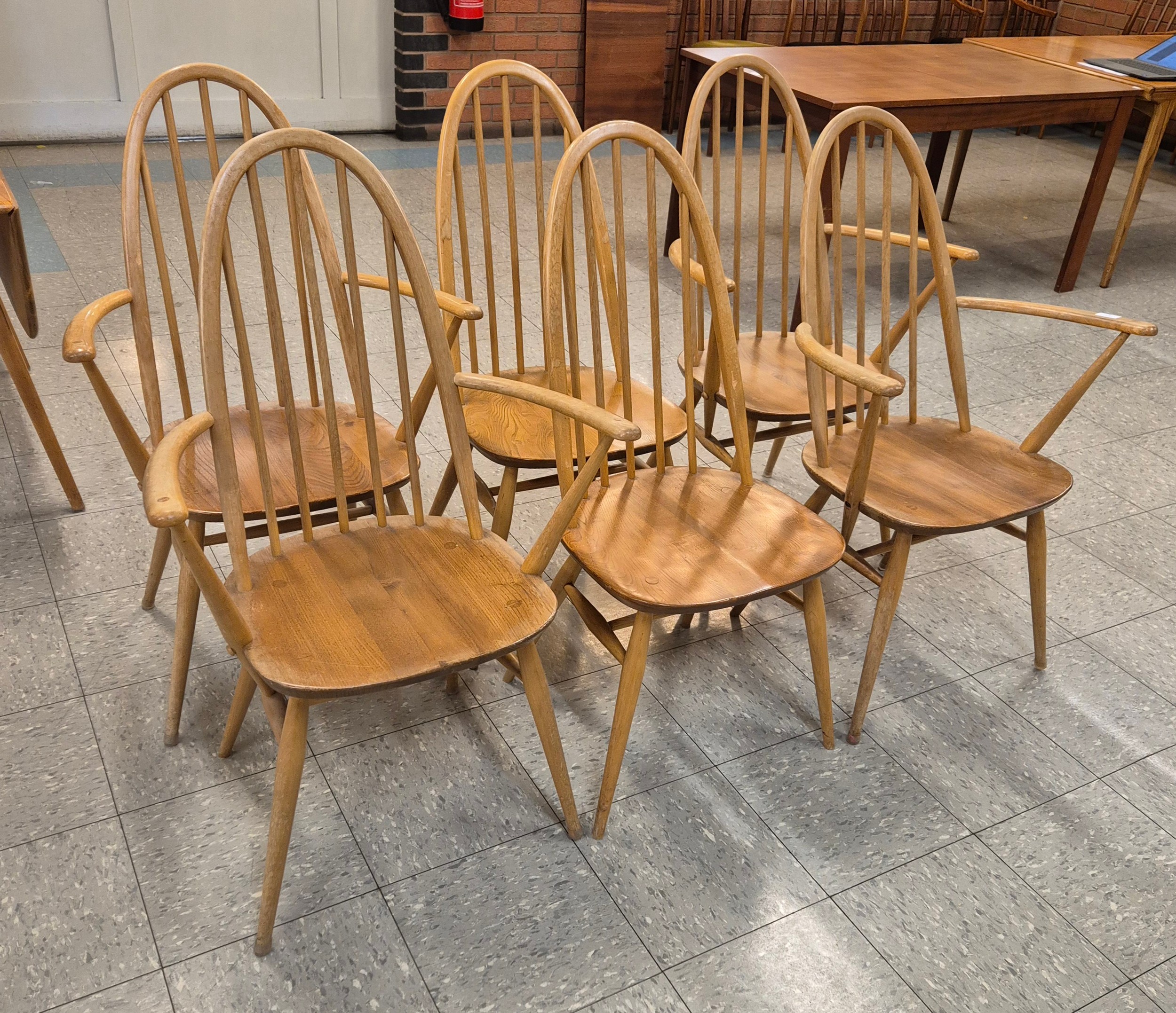 A set of six Ercol Blonde elm and beech Quaker chairs