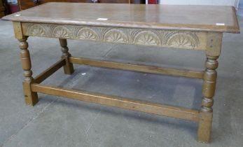 A small 17th Century style carved oak bench