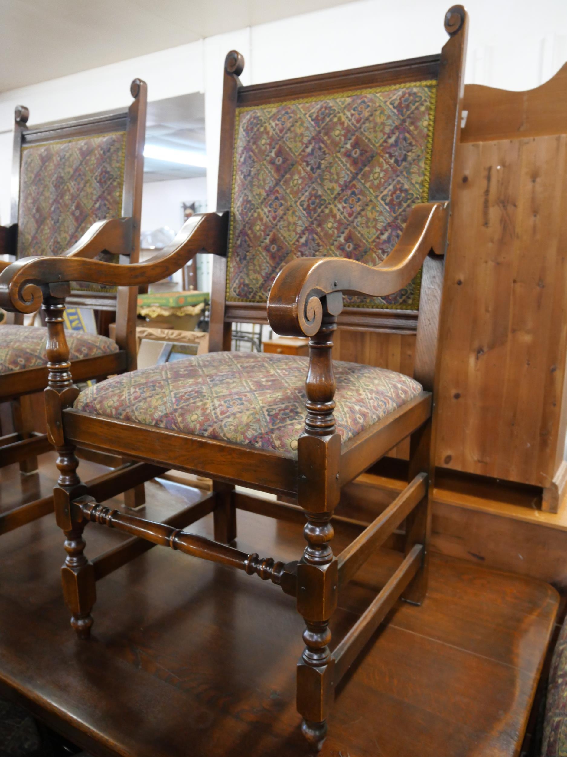 A 17th Century style carved oak refectory table and six chairs - Image 4 of 7