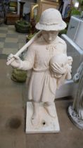 A plaster figure of a girl and lamb