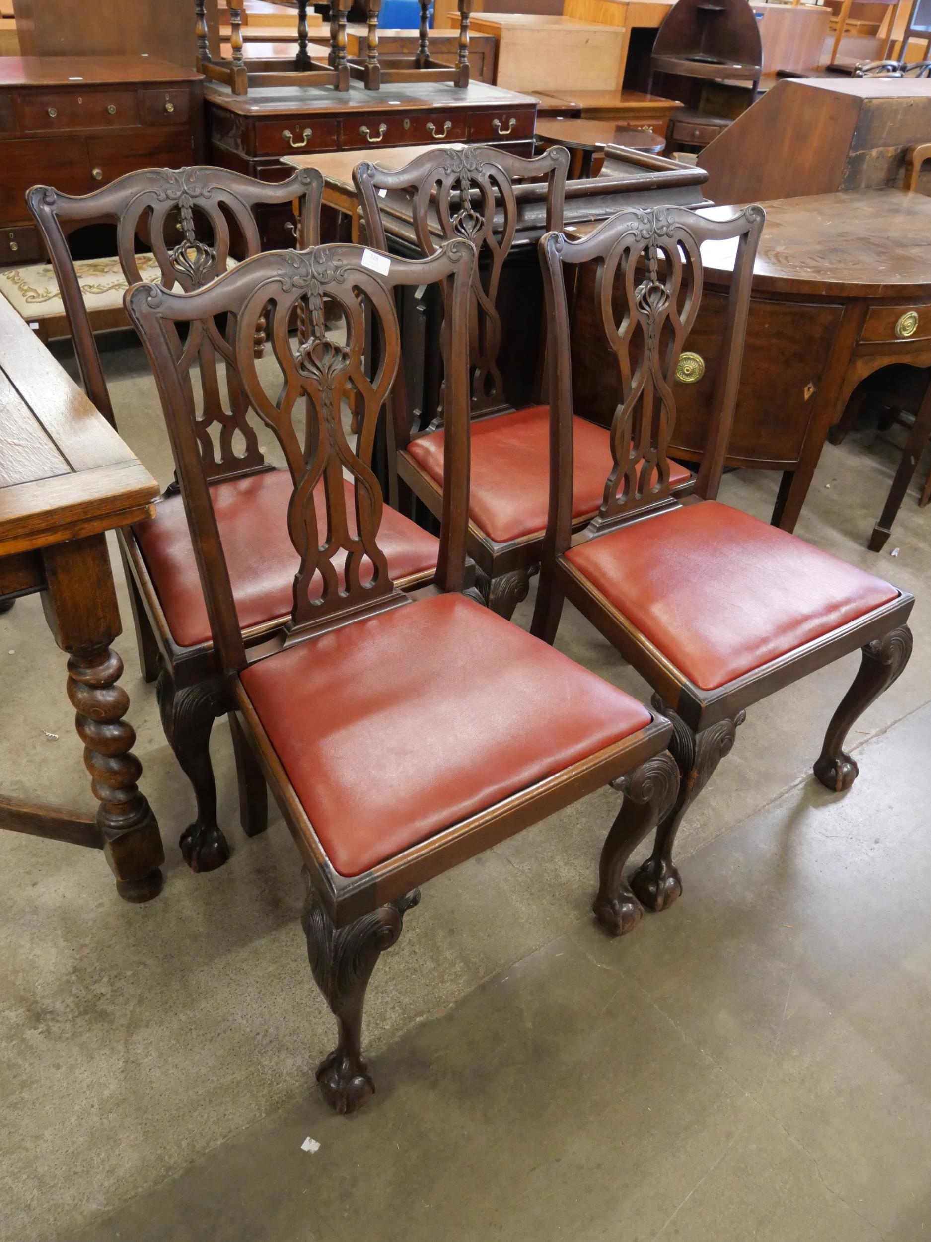 A set of four Chippendale style mahogany dining chairs