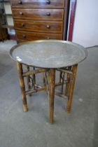 A Persian brass topped occasional table