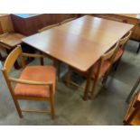 A teak dining extending table and six chairs