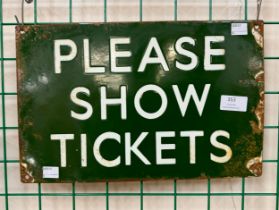 An enamelled please show tickets sign
