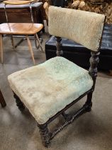 An Arts and Crafts oak fireside chair