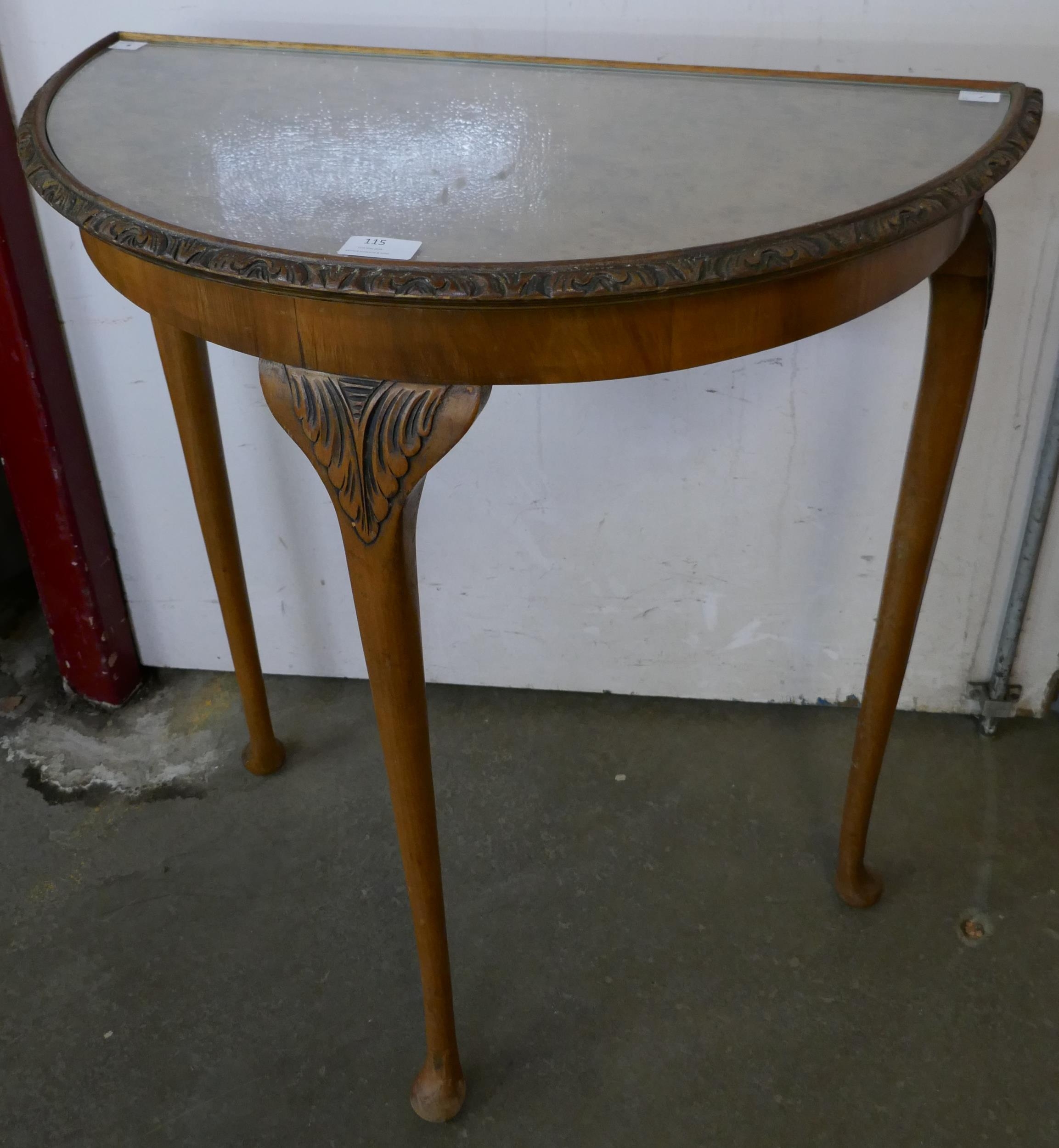 A burr walnut demi lune hall table