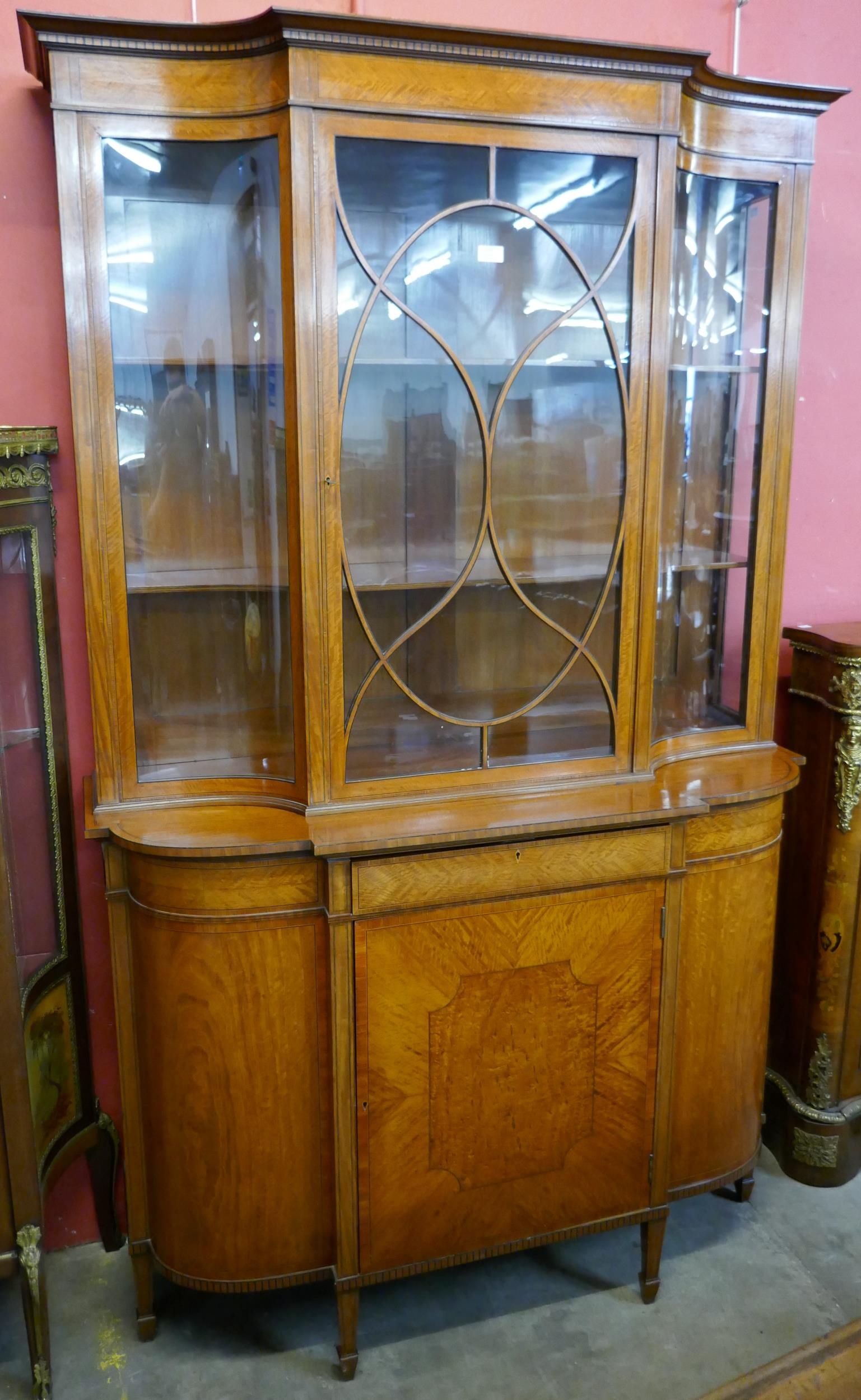 An Edward VII satinwood Sheraton Revival breakfront bookcase