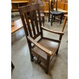 A Scottish Arts and Crafts oak chair, designed by Sir Robert Stodart Lorimer
