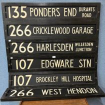 Six wooden London bus destination signs