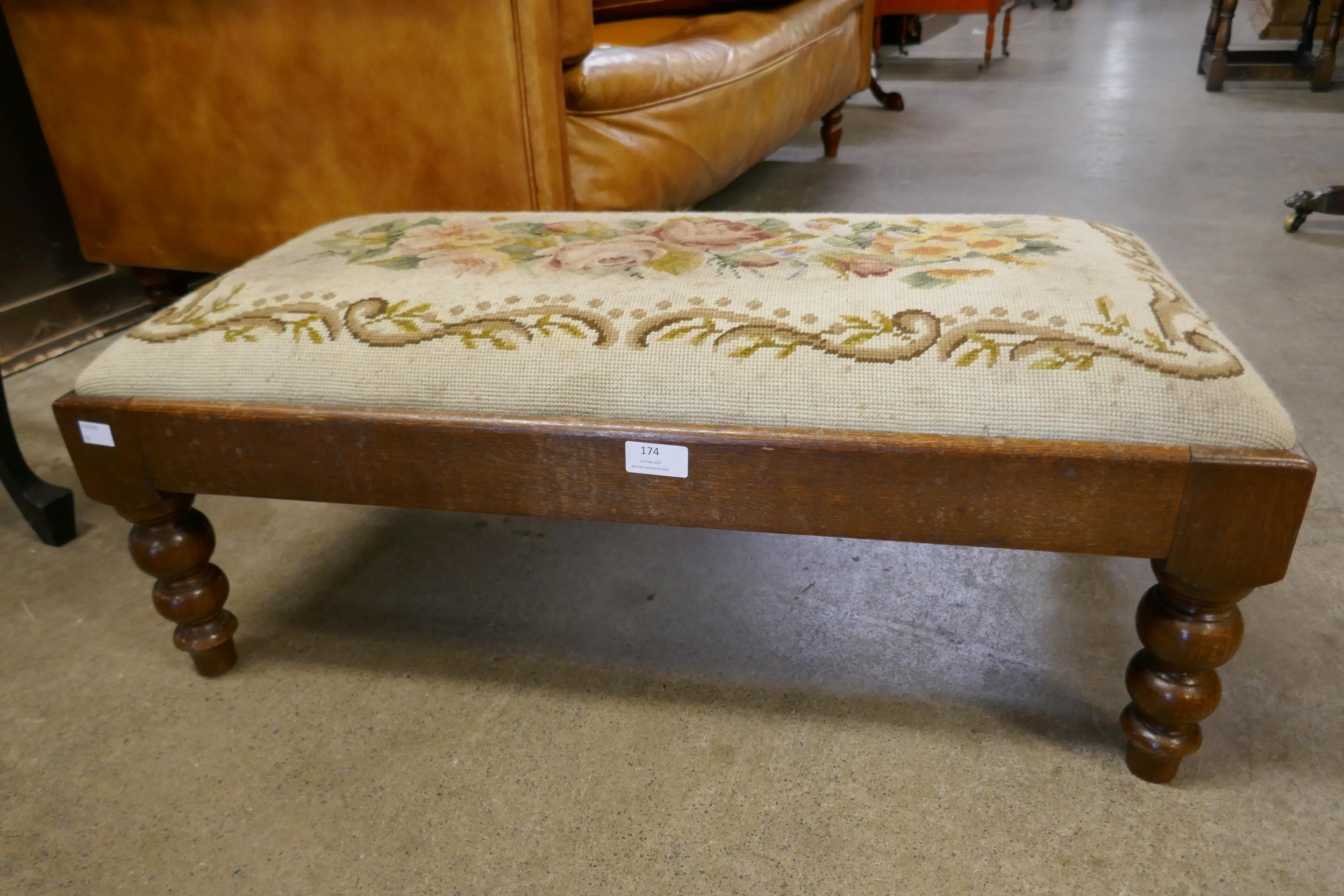 A Victorian style mahogany footstool