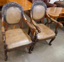 A pair of late 19th Century Anglo-Indian rosewood and leather open armchairs