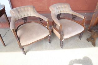 A pair of Victorian walnut and fabric upholstered tub chairs