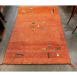 An orange ground rug