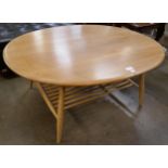 An Ercol Blonde elm and beech oval coffee table