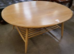 An Ercol Blonde elm and beech oval coffee table