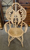 A wicker and bamboo peacock chair