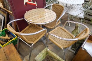 An aluminium bistro table and three chairs