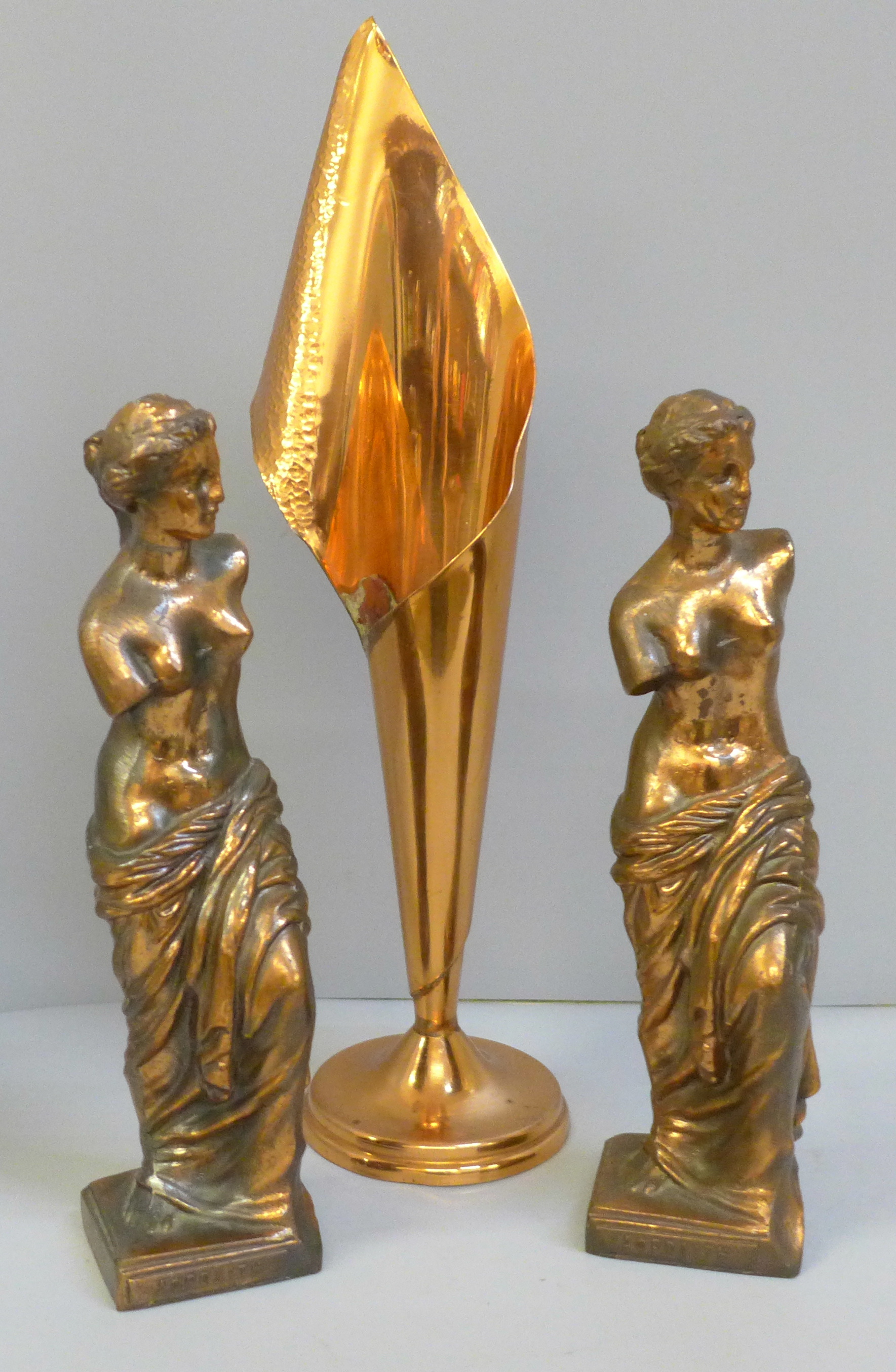 A pair of copper toned metal figures of Aphrodite and a Rhodesia copper vase