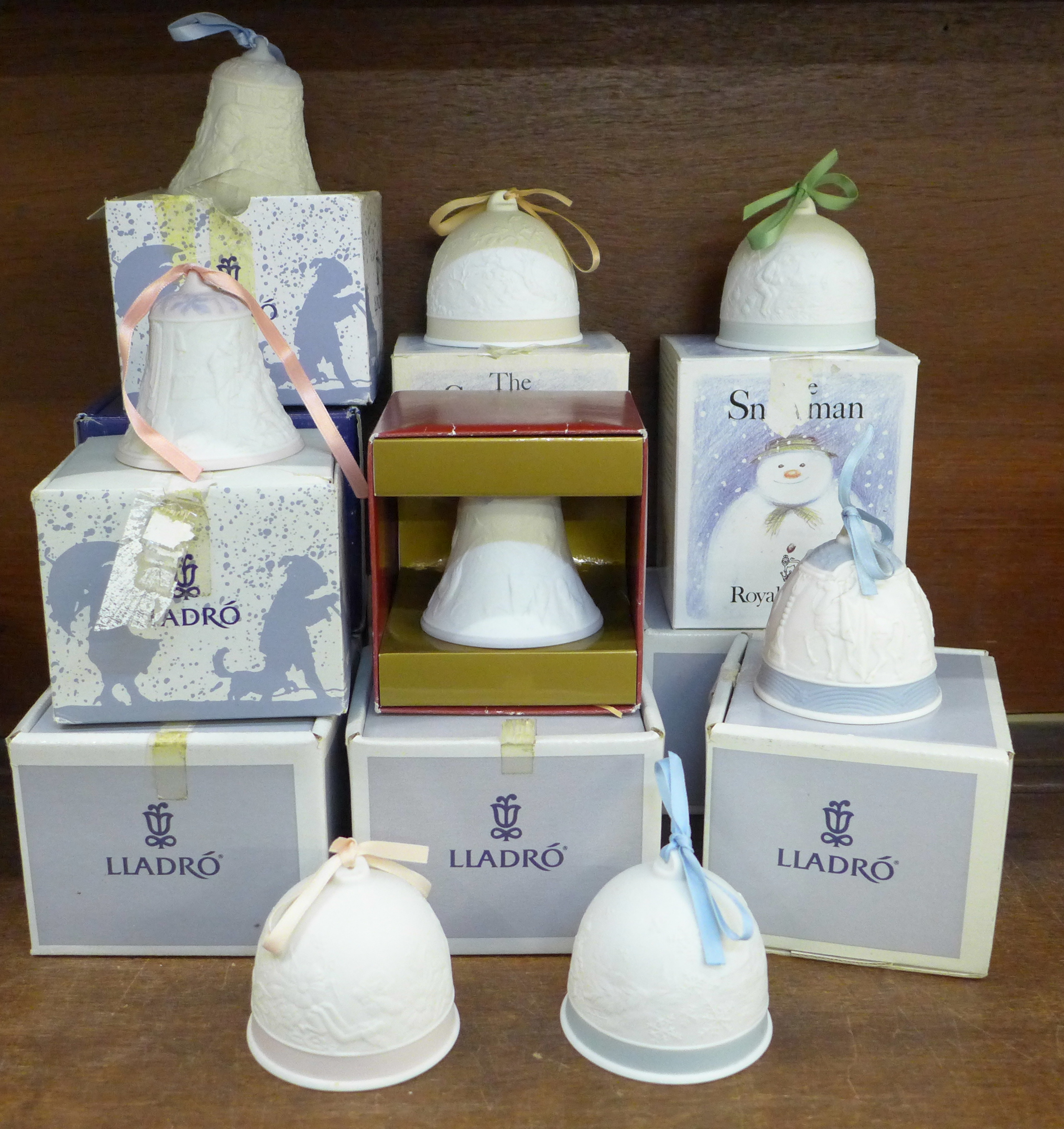 Fourteen Lladro anniversary bells, most in original boxes, 1990 onwards