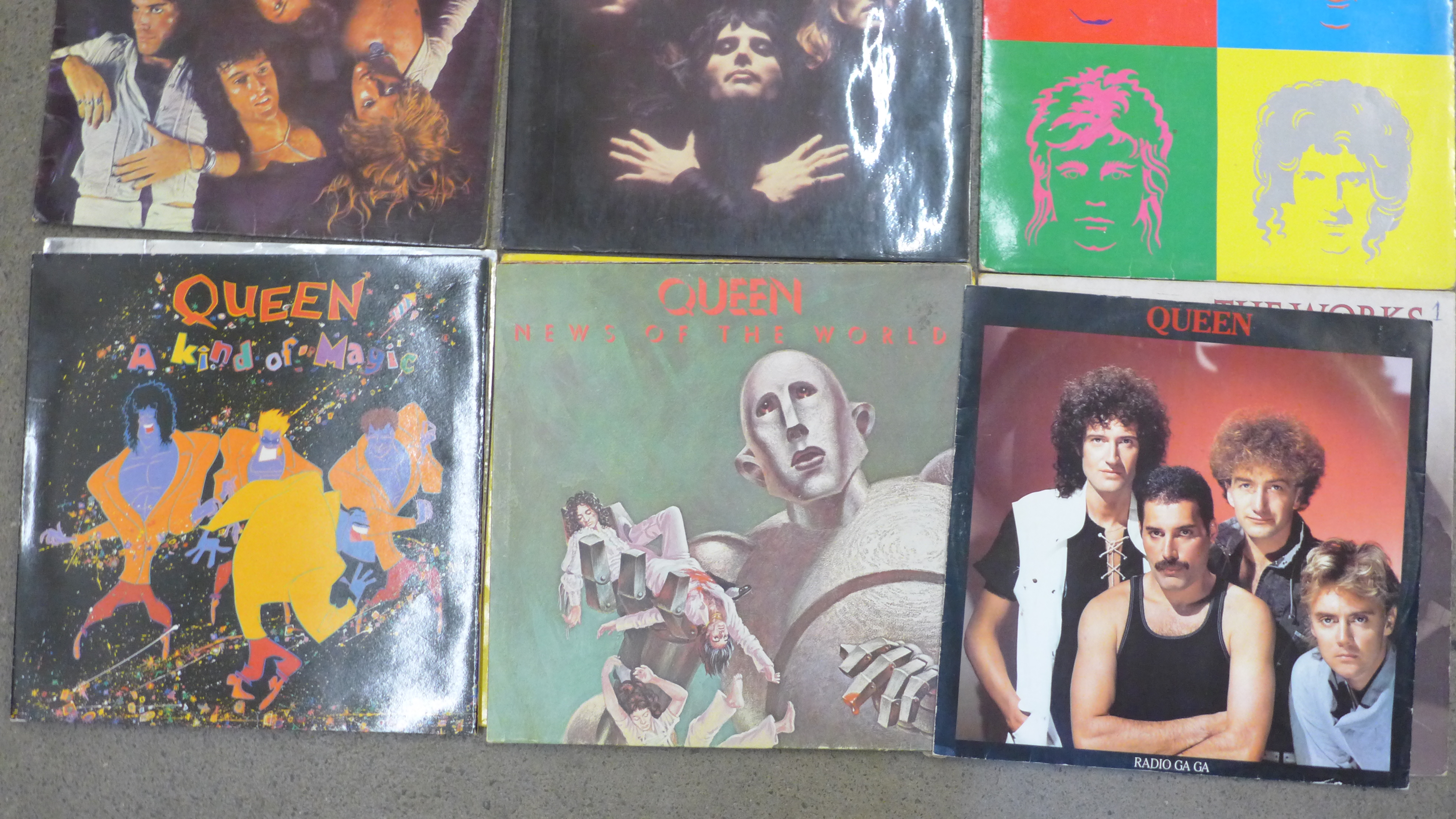 A collection of twelve Queen LP records and a 12" single - Image 2 of 2