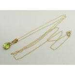 A 10k gold and peridot pendant on a fine 10k gold chain, 0.8g, chain approximately 46cm, pendant 1.