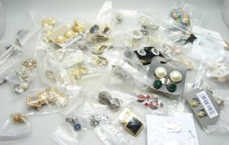 Sixty pairs of clip on earrings